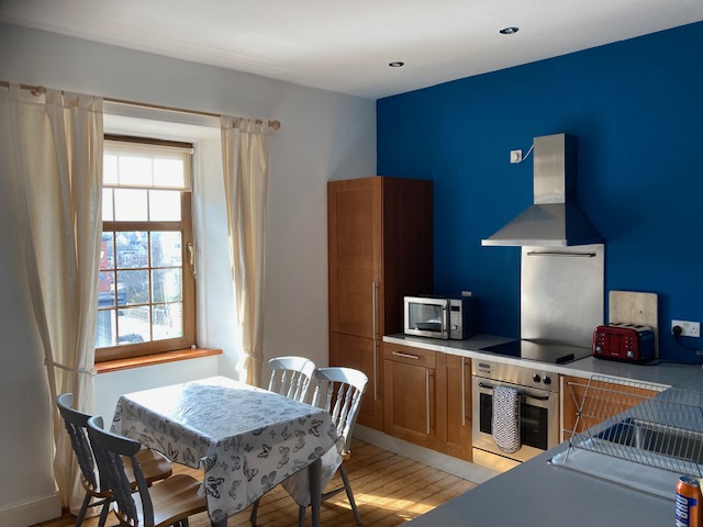 Bright kitchen and dining space in Strathnaver Apartment
